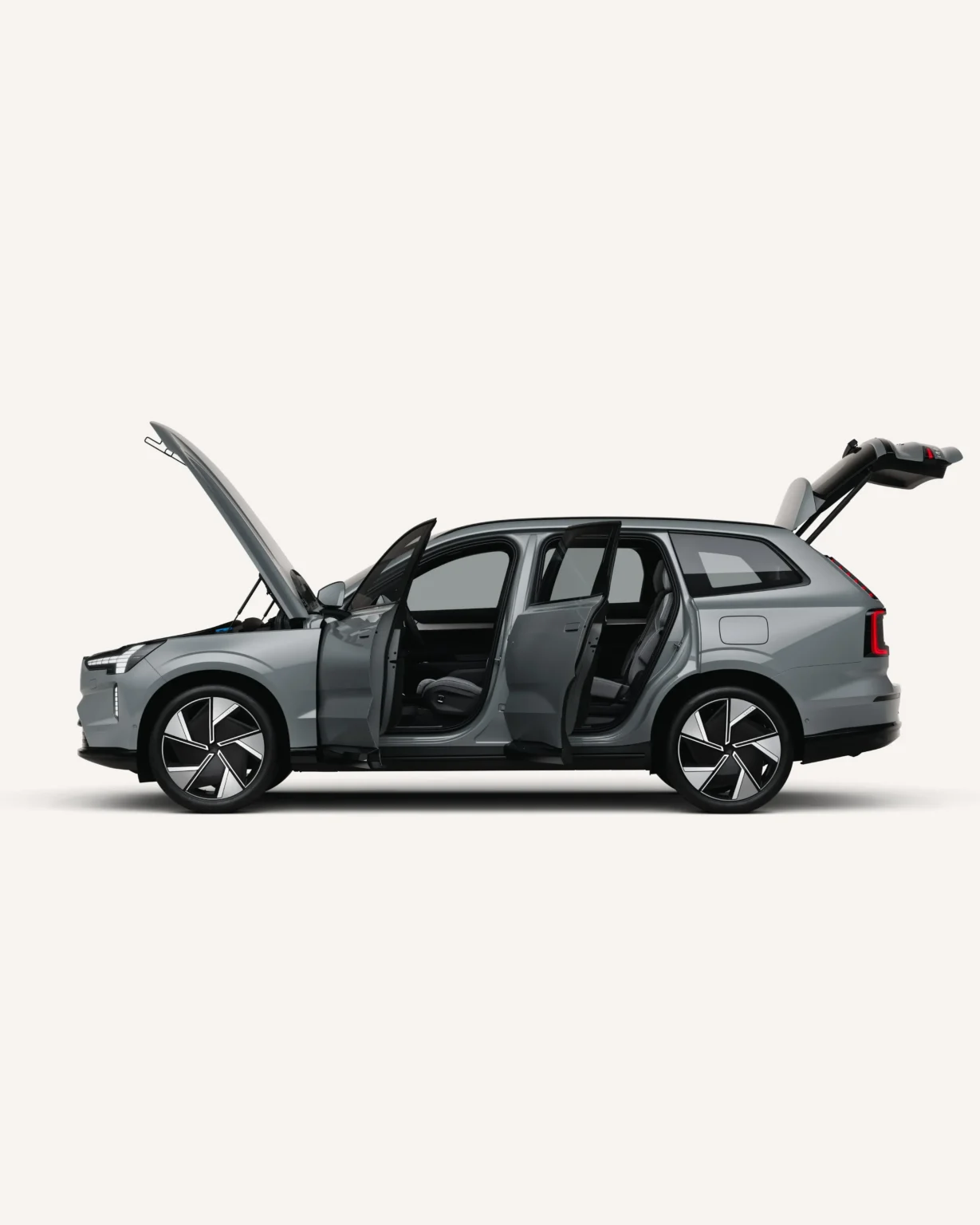 Grey Volvo EX90 in side view with its doors, bonnet and tailgate open