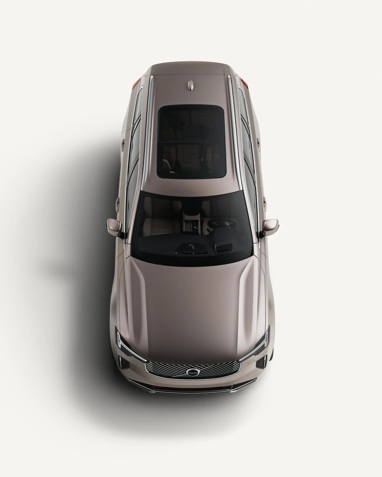 Volvo XC90 seen from above in a white studio, showing its panoramic roof