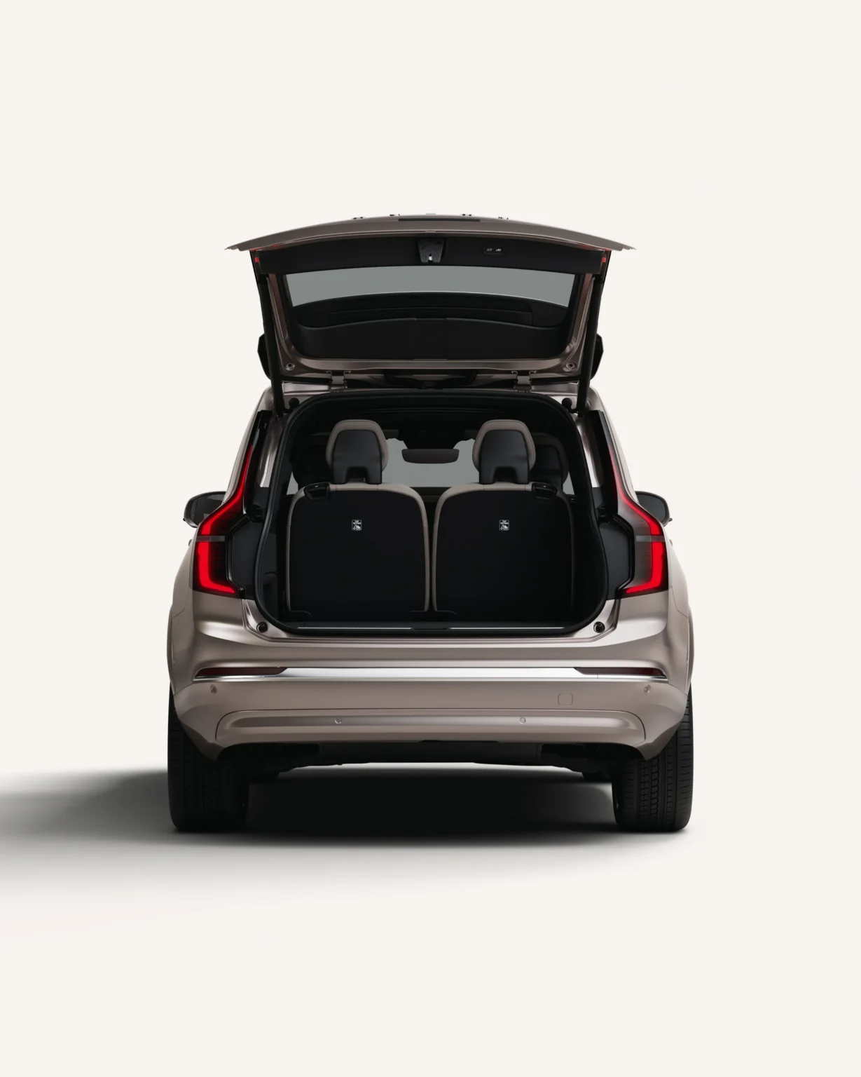 Volvo XC90 from behind with the tailgate open, showing the boot and rear seats