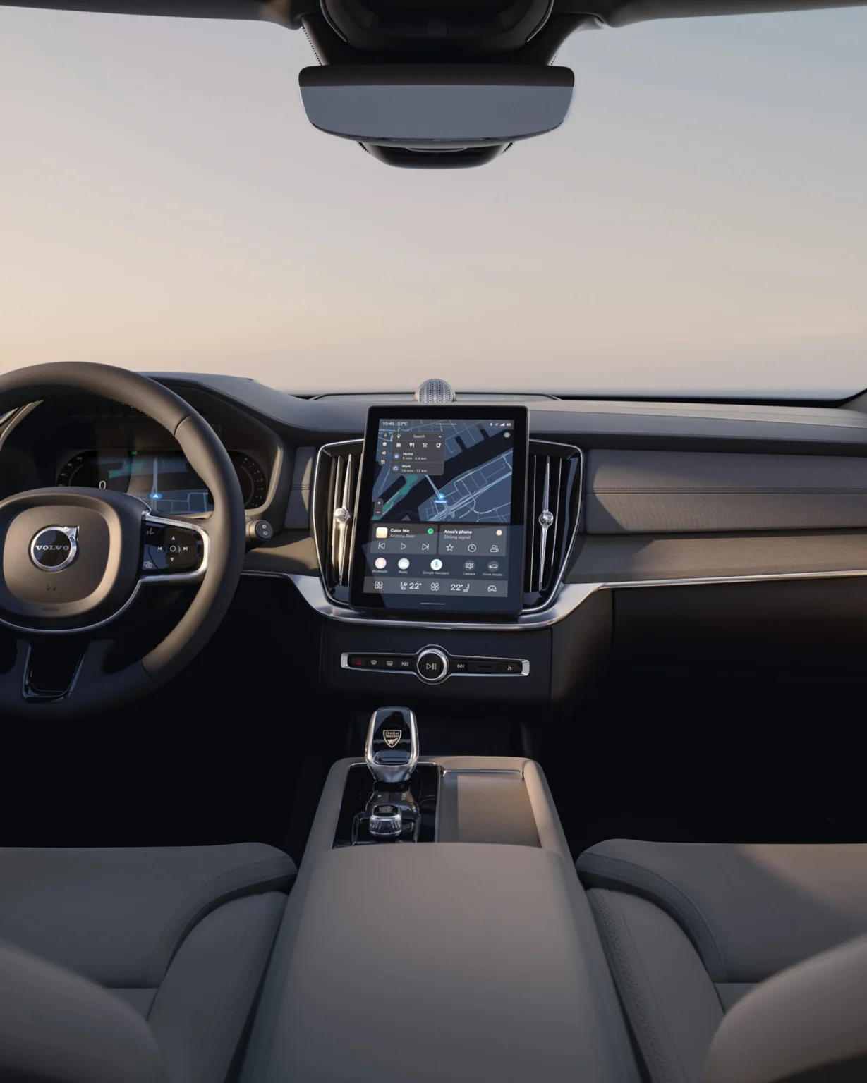 Volvo XC90 dashboard seen from the rear seat, with the driver display and portrait centre screen