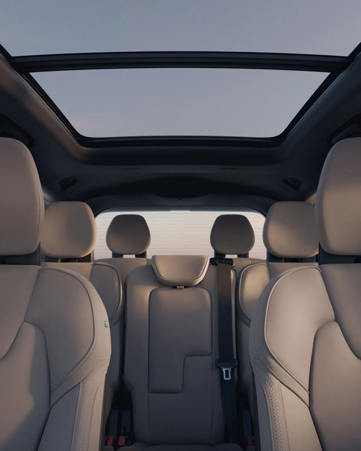 Volvo XC90 seats seen from the back of the cabin, with the panoramic glass roof overhead
