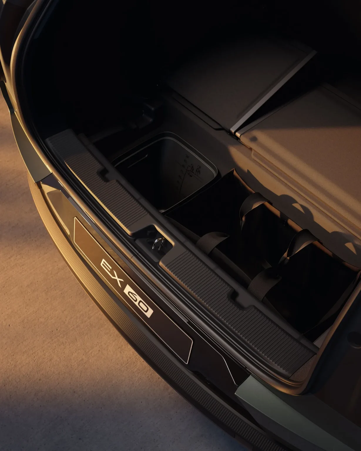 Open boot of a Volvo EX60 with underfloor storage compartments