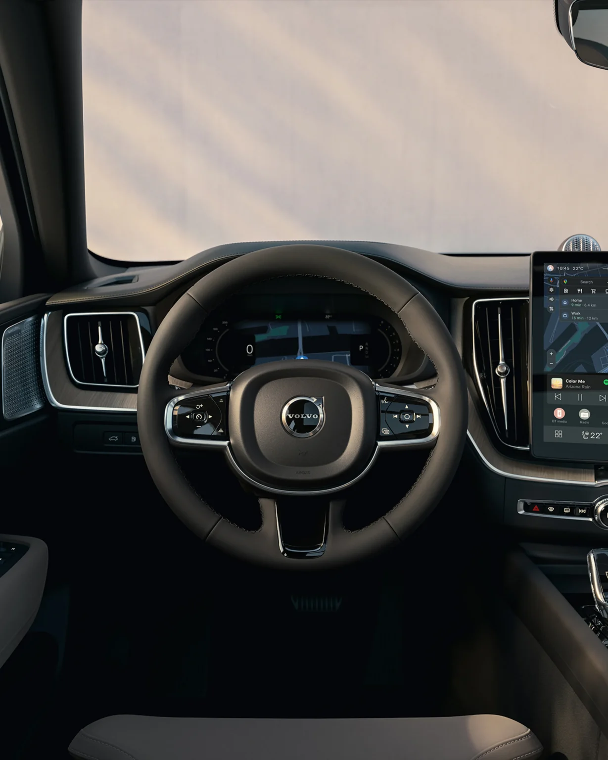 Volvo XC60 dashboard seen from the driver's seat, with the steering wheel and centre touchscreen