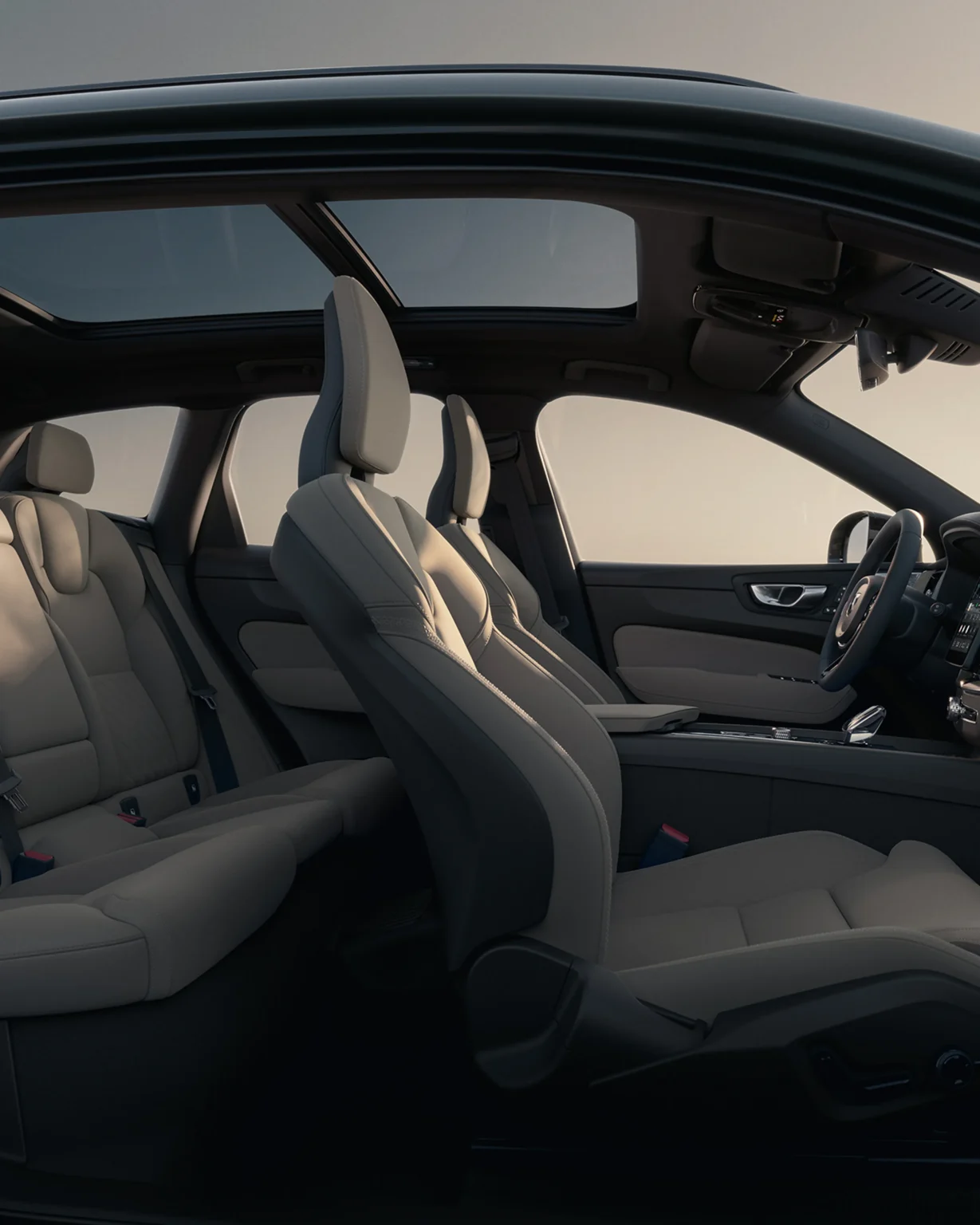 Volvo XC60 front and rear seats in light upholstery, seen through the open doors