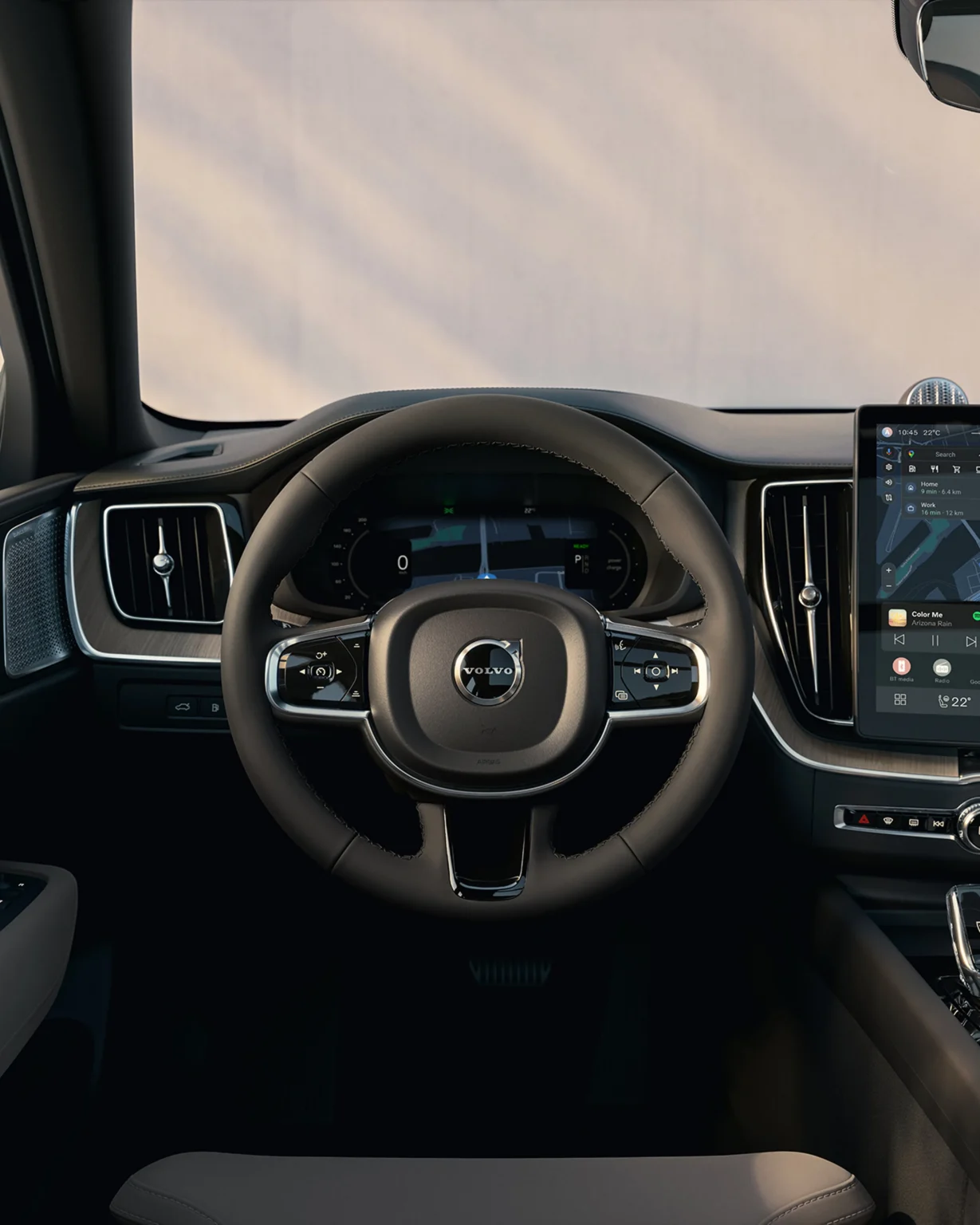 Volvo XC60 dashboard seen from the driver's seat, with the steering wheel and centre touchscreen