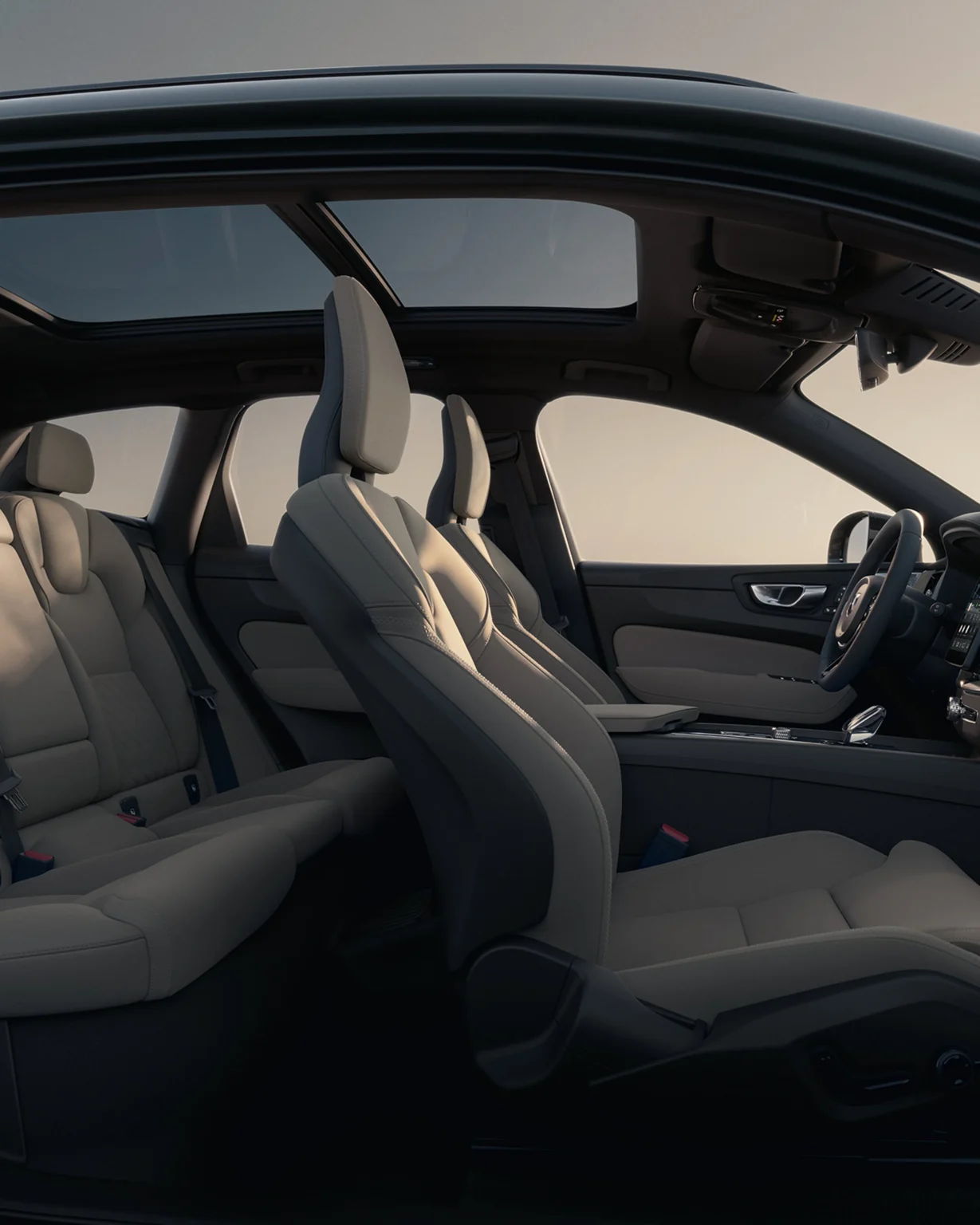 Volvo XC60 front and rear seats in light upholstery, seen through the open doors