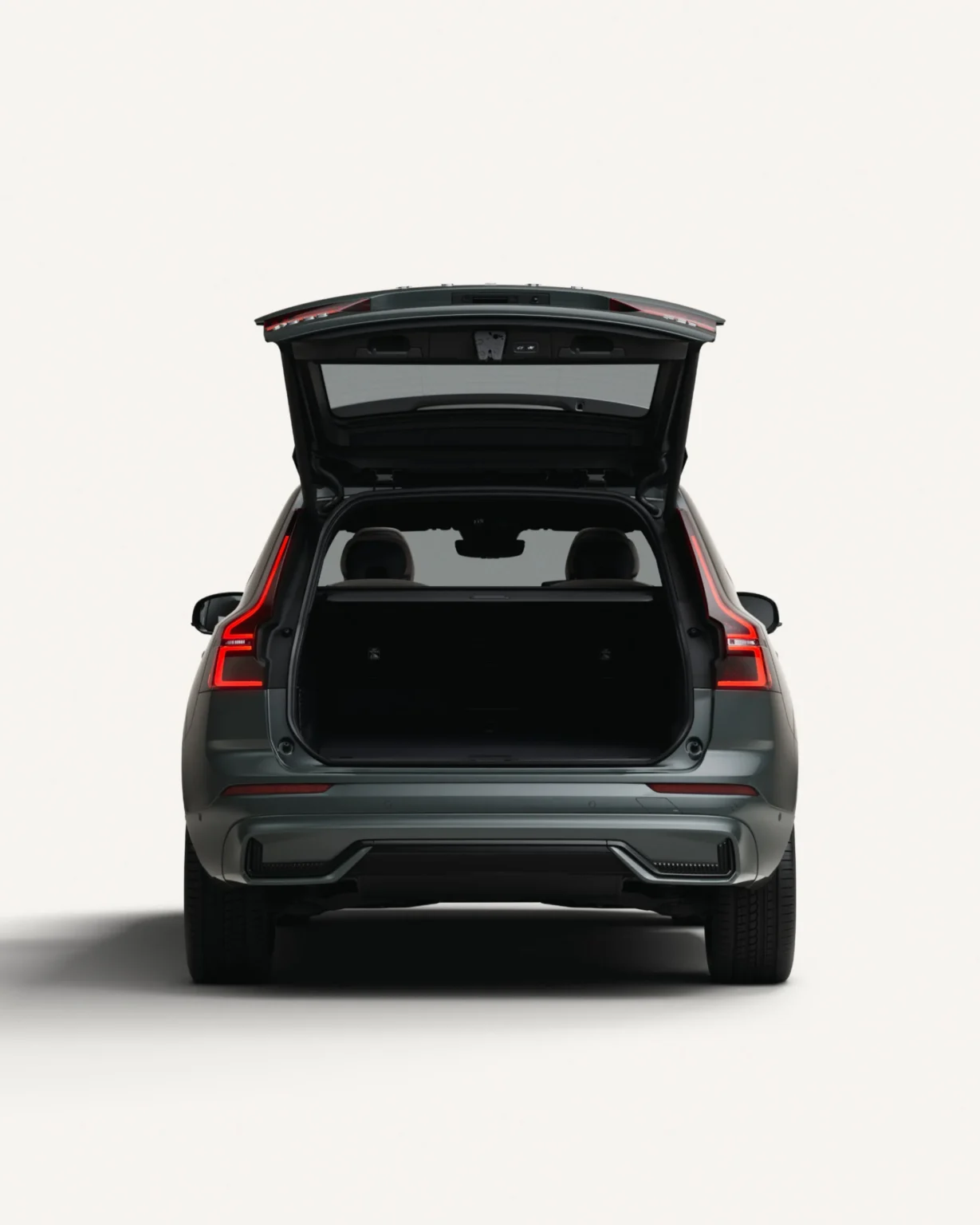 Volvo XC60 Plug-in Hybrid from behind with the tailgate open, showing the boot