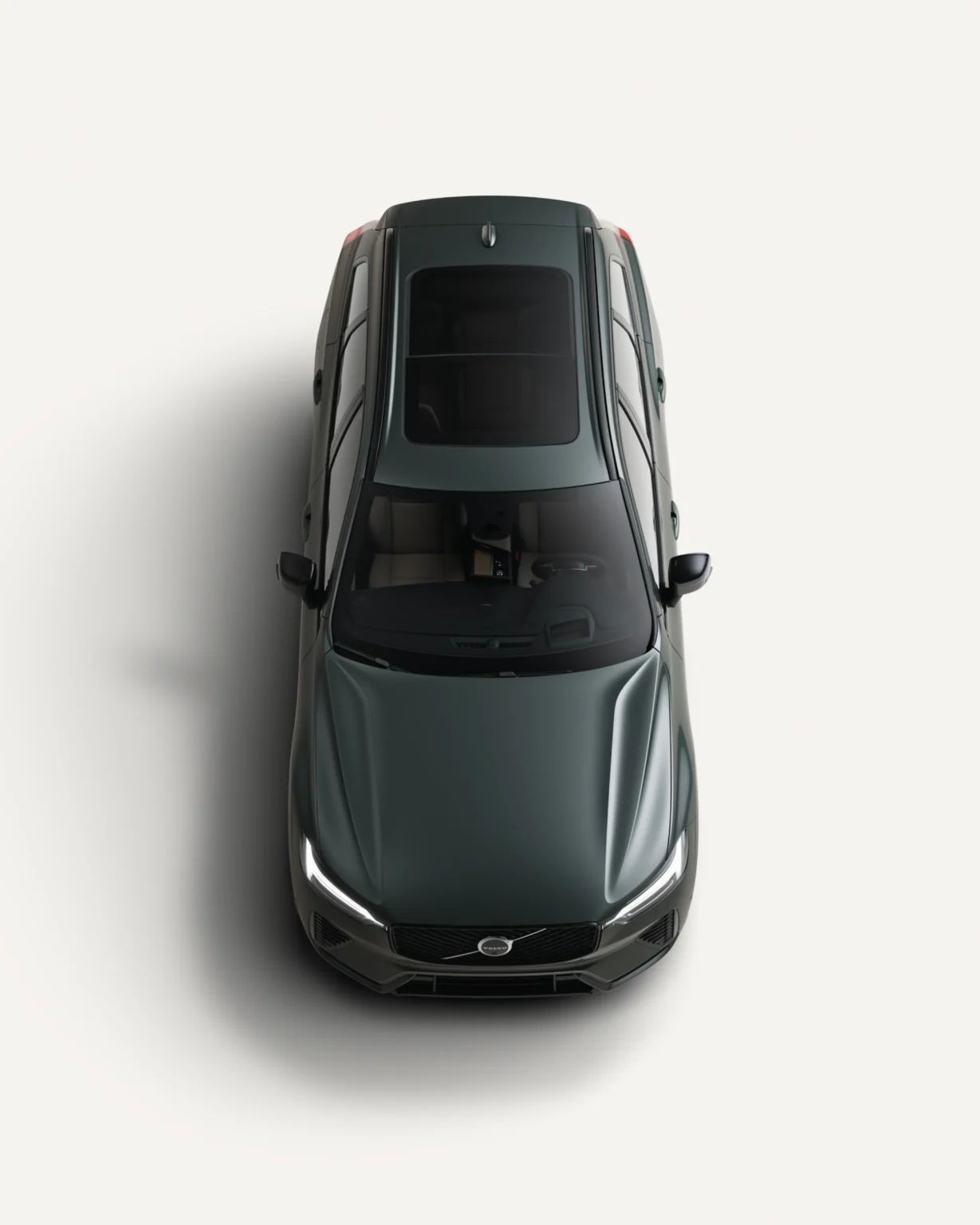 Volvo XC60 seen from above in a white studio, showing its panoramic roof