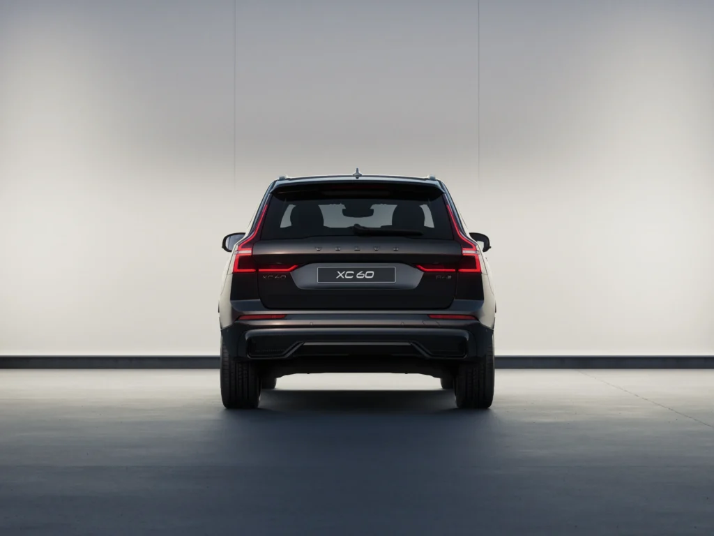 Volvo XC60 Black Edition from behind in a softly lit studio