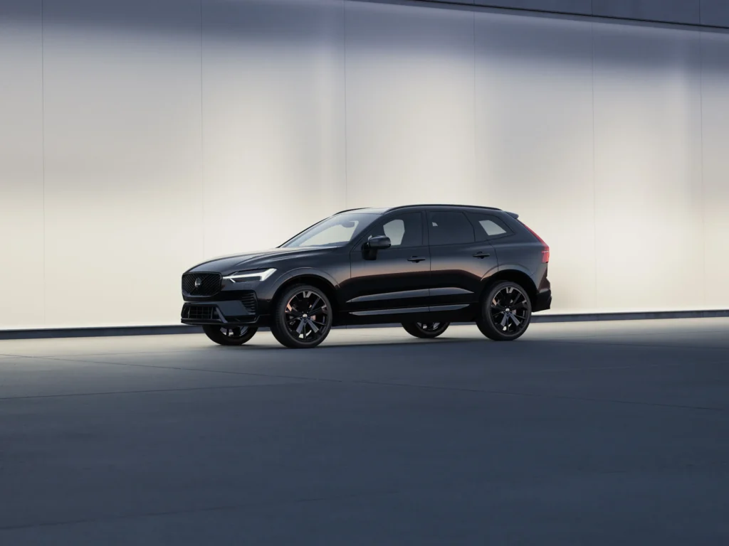 Volvo XC60 Black Edition from the side in a softly lit studio
