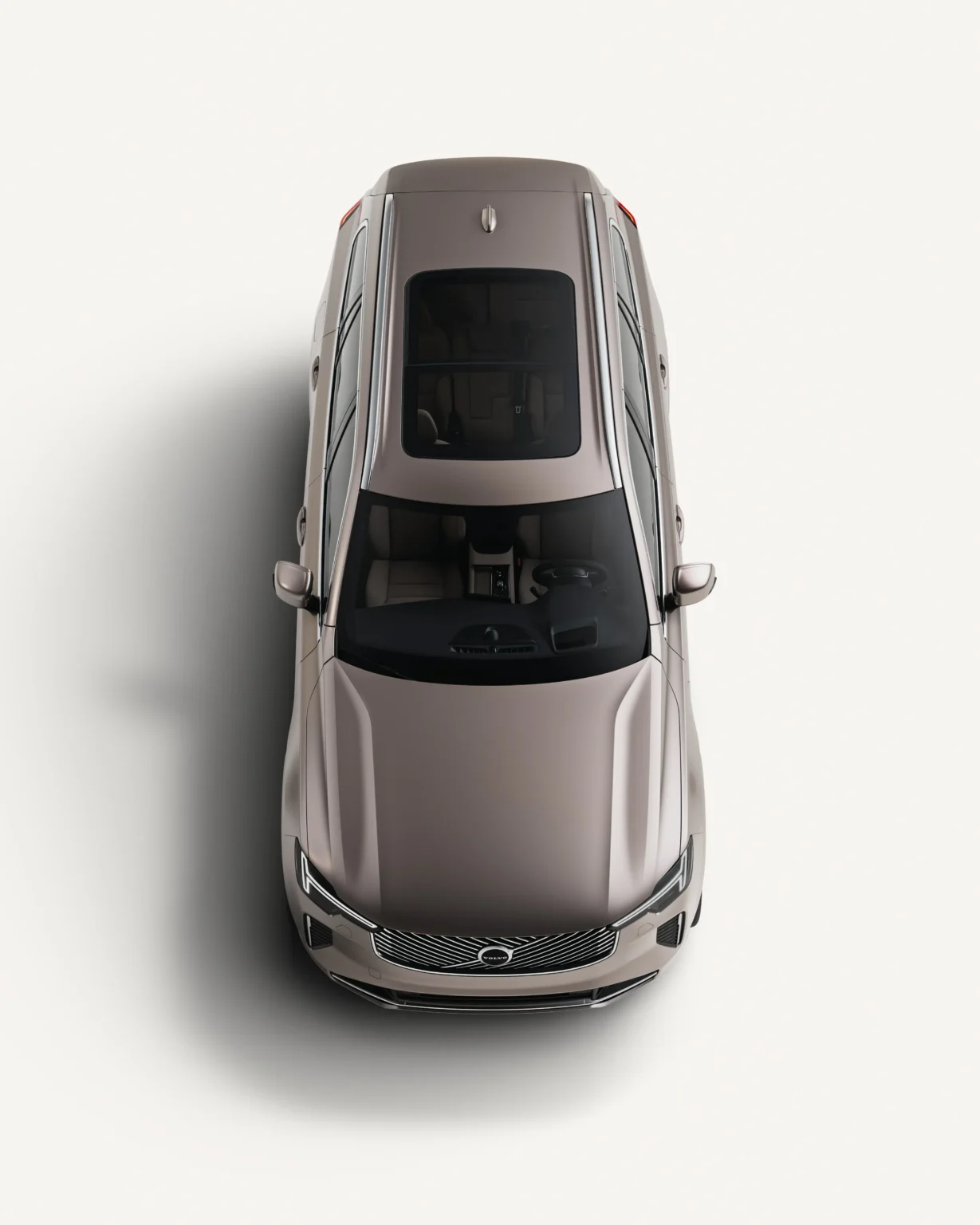 Volvo XC90 seen from above in a white studio, showing its panoramic roof
